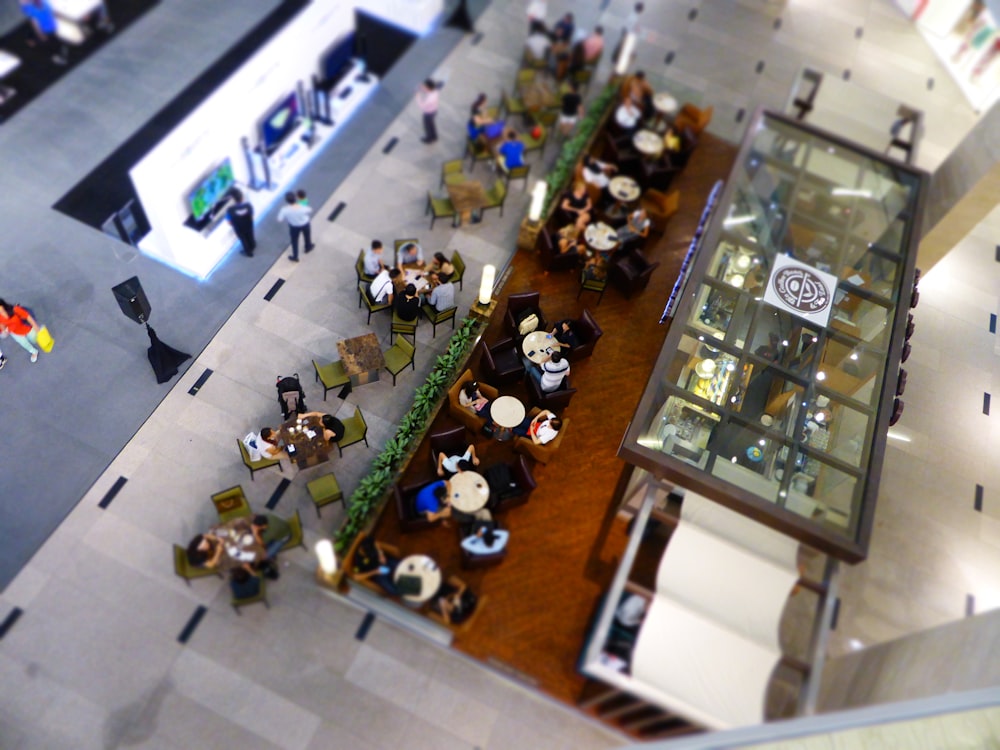 aerial view of people eating inside building during daytime